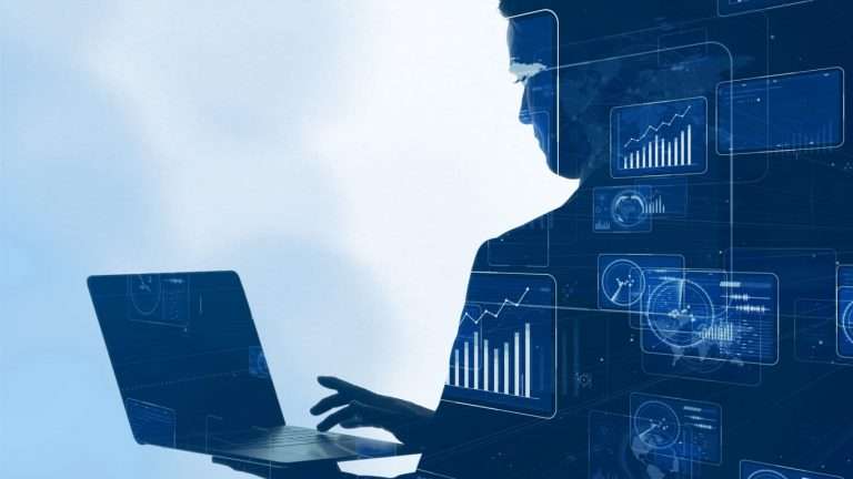 Business man working on his computer with tech imagery overlayed