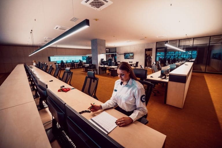 An empty department with a police shortage - one person sitting with empty chairs